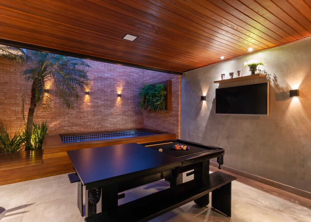 área gourmet integrada com sala e tv