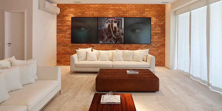 decoração de sala com parede de tijolinho aparente