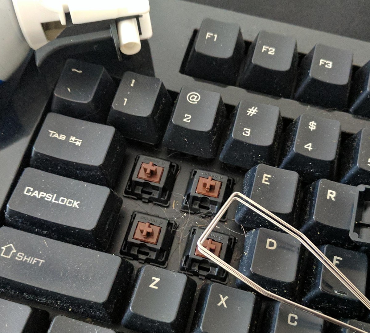 como limpar sensor óptico do mouse